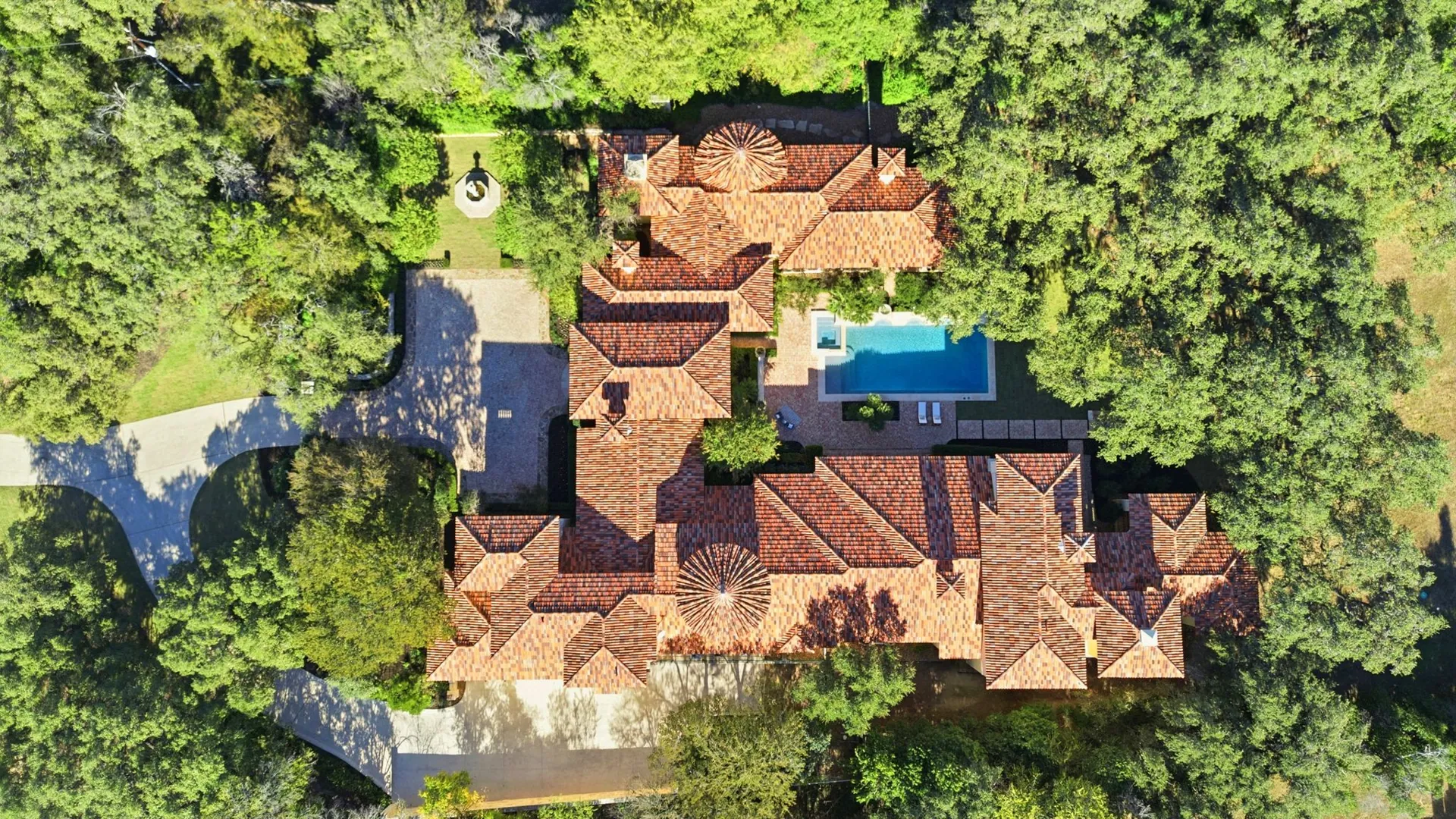 The estate from above, with the sun's path drawn over it
